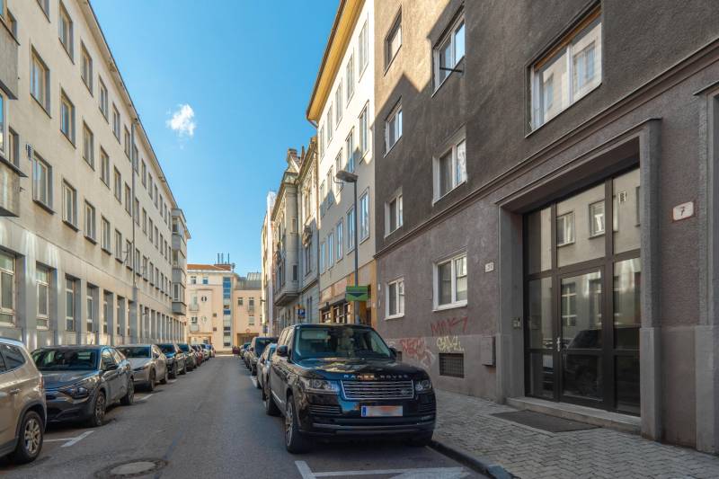 Heydukova Street in Bratislava - Old Town, with parked cars and surrounding buildings.