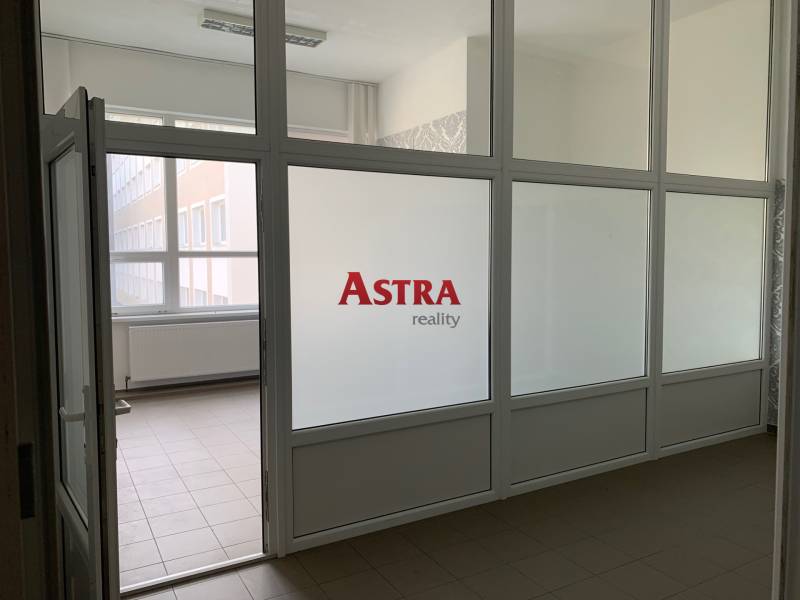 Offices with partition walls, surrounded by glass surfaces, simple design.