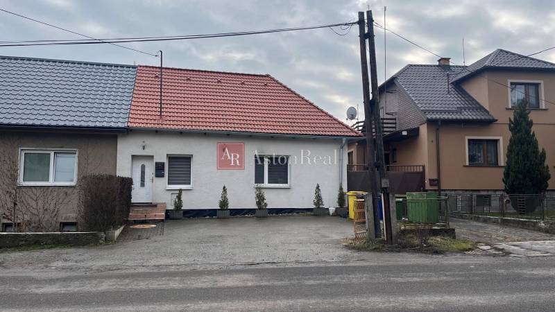 A family house in Lieskovec on Osloboditeľov Street, with a gable roof and a front garden.