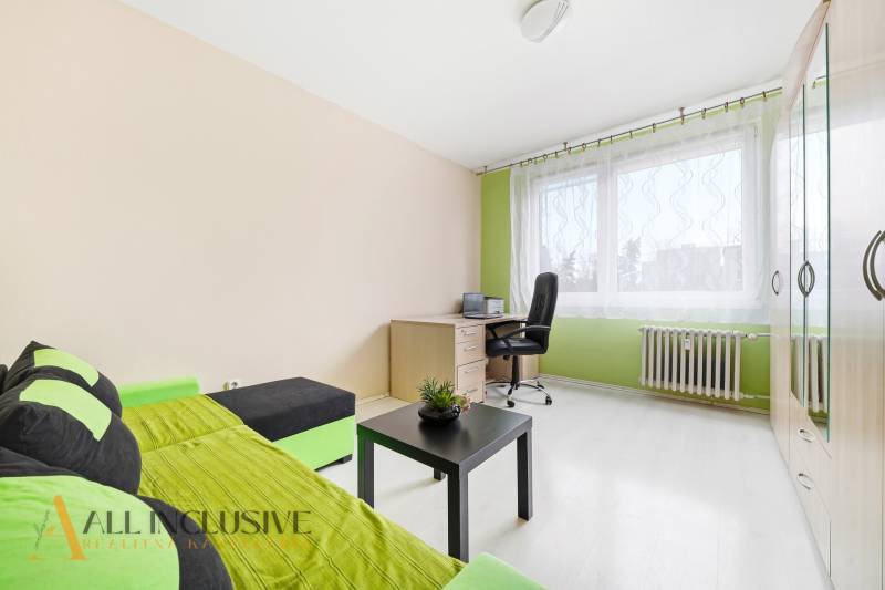 A bright room with a desk and a sofa, 3-room apartment.
