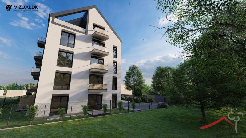 A building with balconies on Moravská Street in Vráble, surrounded by greenery, Commercial land.