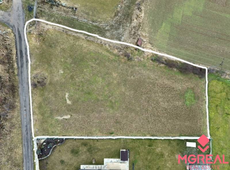 Aerial view of residential plots in the town of Kuzmice, on a quiet street.