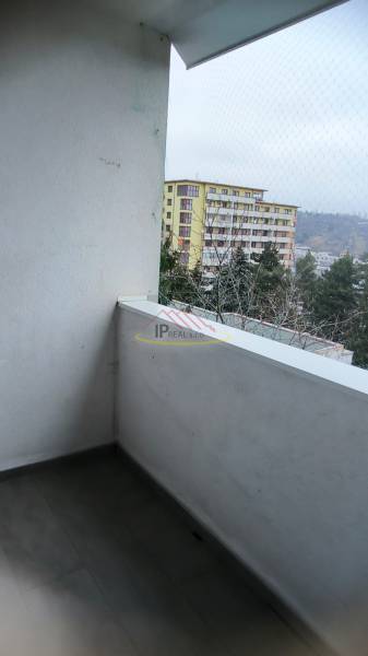 The balcony of a 4-room apartment on Janotova Street, Bratislava - Karlova Ves, with a view of the surroundings.