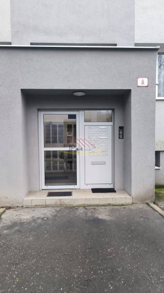 The entrance area of the apartment building with security doors on Janotova Street in Bratislava - Karlova Ves.