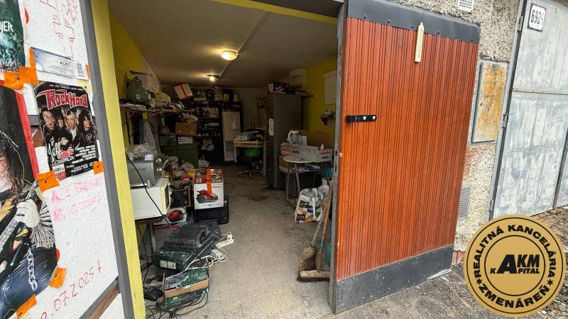 An open garage full of various items and posters in the garage on Prachatická Street in Zvolen.