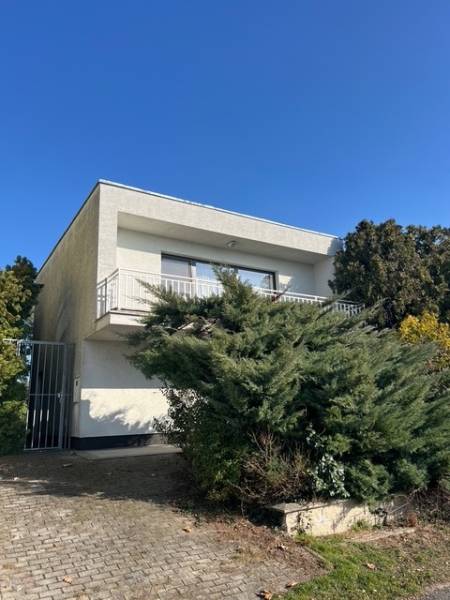 A cottage on the Sunny Lakes in Senec with a terrace and abundant greenery.