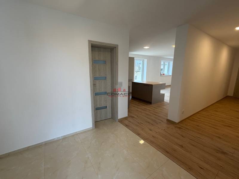 Interior of a family house with a wooden decor floor and wooden doors.