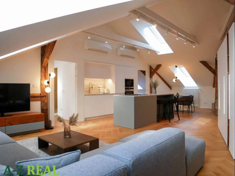 Attic interior with a kitchen, sofa set, and wooden decor flooring, 3-room apartment.