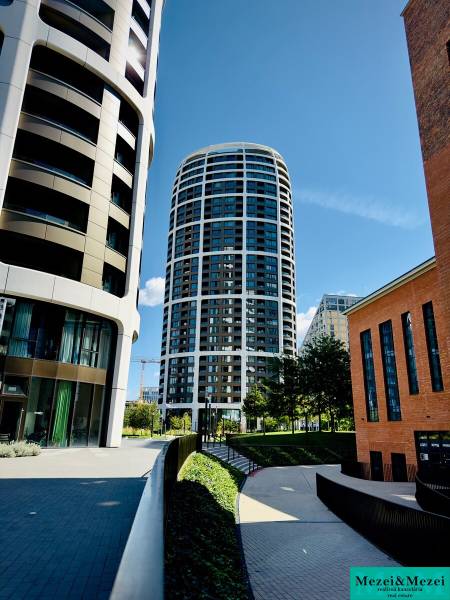 Modern residential buildings, landscaped sidewalks, and greenery in Bratislava - Staré Mesto.