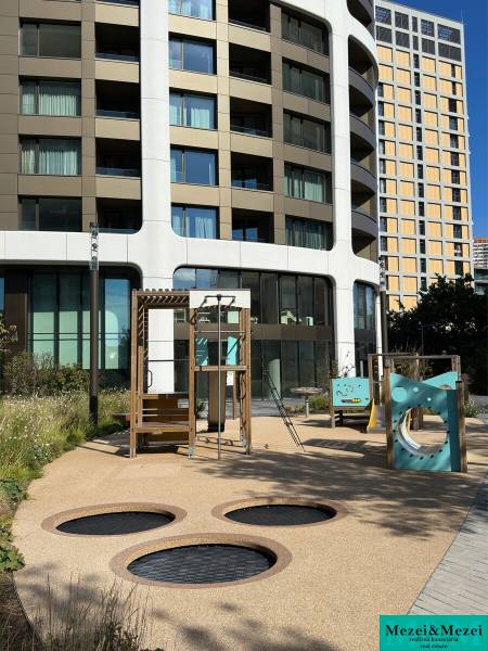 Children's playground in Bratislava - Old Town in front of a modern residential building.