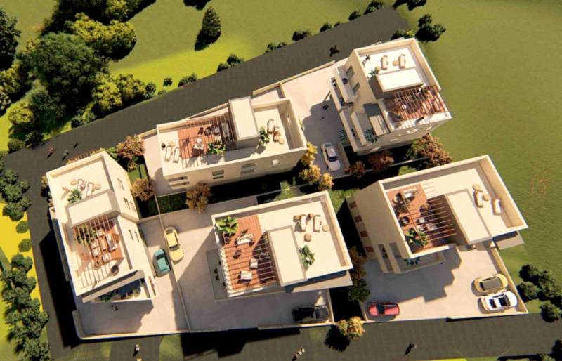 Aerial view of a complex with 2-bedroom apartments in Petrčane surrounded by greenery.