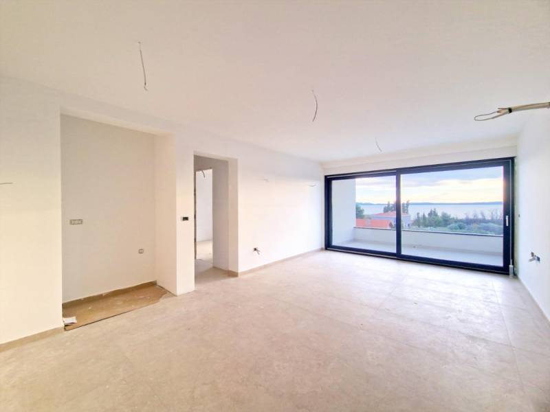 Spacious living room in a 3-room apartment with a sea view.