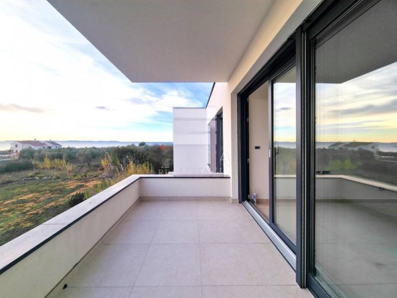 A balcony with a view of nature in a 3-room apartment, Privlaka.