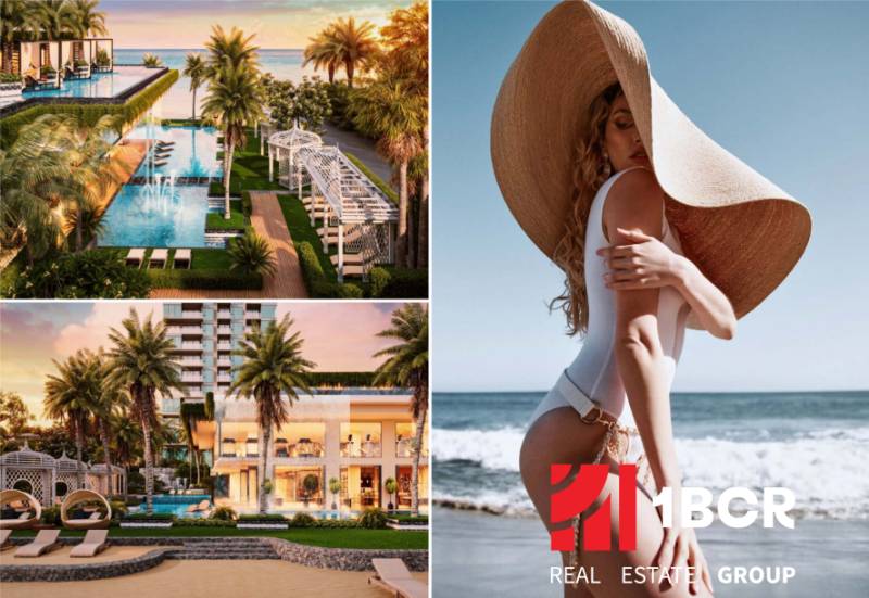 Pattaya, construction of apartments with a luxury pool, palm trees, and a modern coastline.