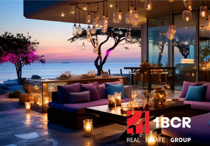 Luxury terrace with sea view and ambient lighting within the Apartment Construction.