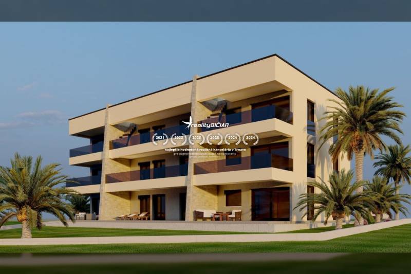 Apartment building in Nin on a street in Nin, surrounded by palm trees and terraces.