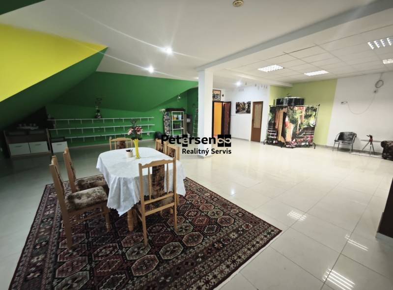 Interior of a family house with a dining table and colorful accents on the walls.