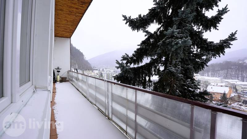 Balcony in a 3-room apartment on Gogoľova Street in Trenčianske Teplice, with a view of the snowy landscape.
