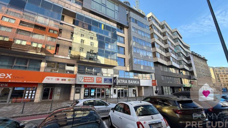 Exterior of offices on Dunajská Street in Bratislava - Old Town, with a parking lot.