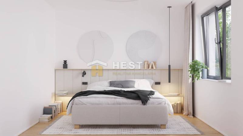 Bright bedroom with a comfortable double bed and a large window in a family house.