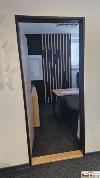 Design wall and office furniture in an office with interesting decor.