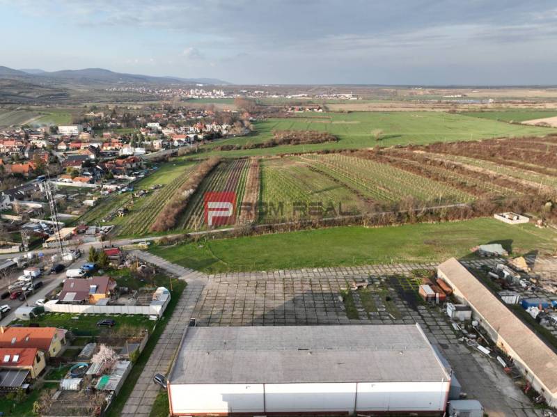 Production facilities on Pezinská Street in Vinosady surrounded by vineyards and nature.