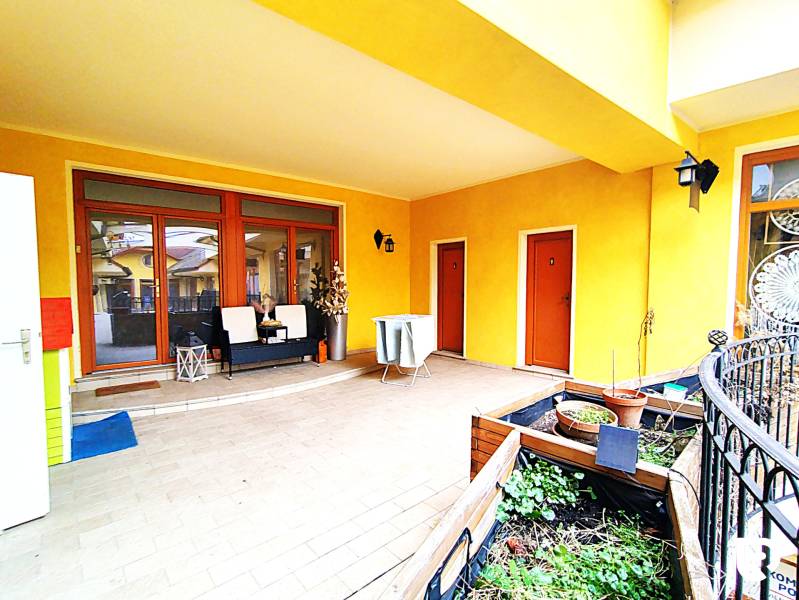 Terrace at a 2-room apartment on Potočná Street in Skalica with plants and seating.