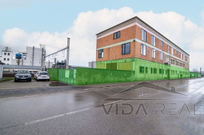 The building on Nádražná Street in Šenkvice, serving as warehouses and halls.