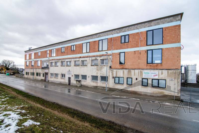 Building on Nádražná Street in Šenkvice, designated for warehouses and halls.