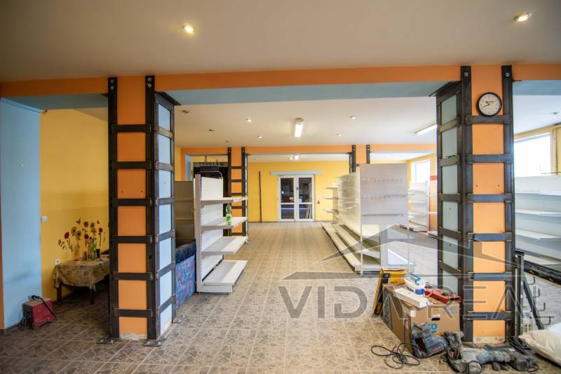 Interior of a warehouse with shelves and a floral motif on the wall, Warehouses and halls.