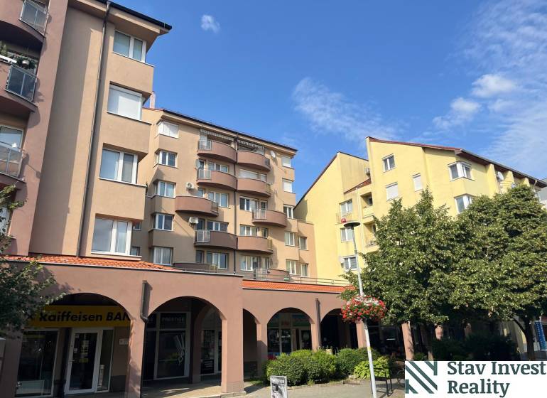 A building on Lichnerova Street in Senec with 4-room apartments, shops, and balconies.