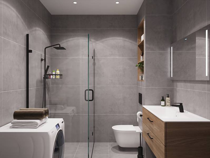 Bathroom with a shower, sink, and washing machine in a studio apartment.