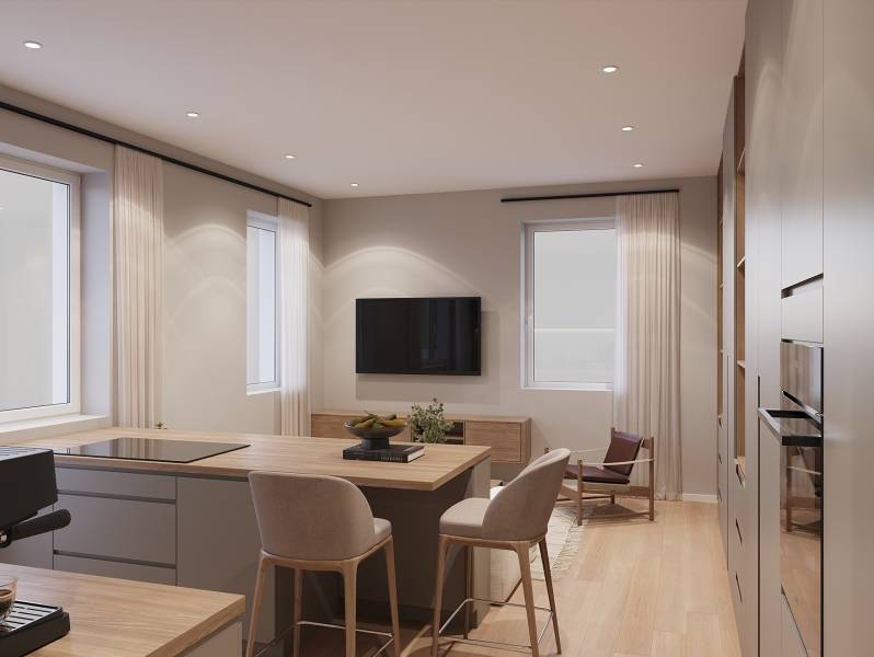 A simple interior of a one-room apartment with a kitchen and living area, wooden decor flooring.
