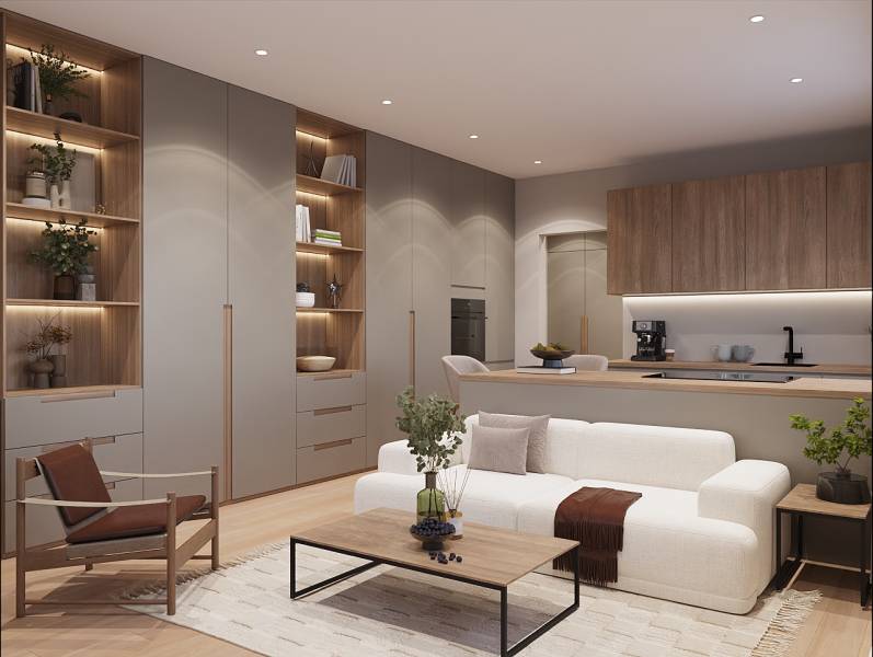 Bright living space in a studio apartment with wood-patterned flooring and a built-in bookshelf.