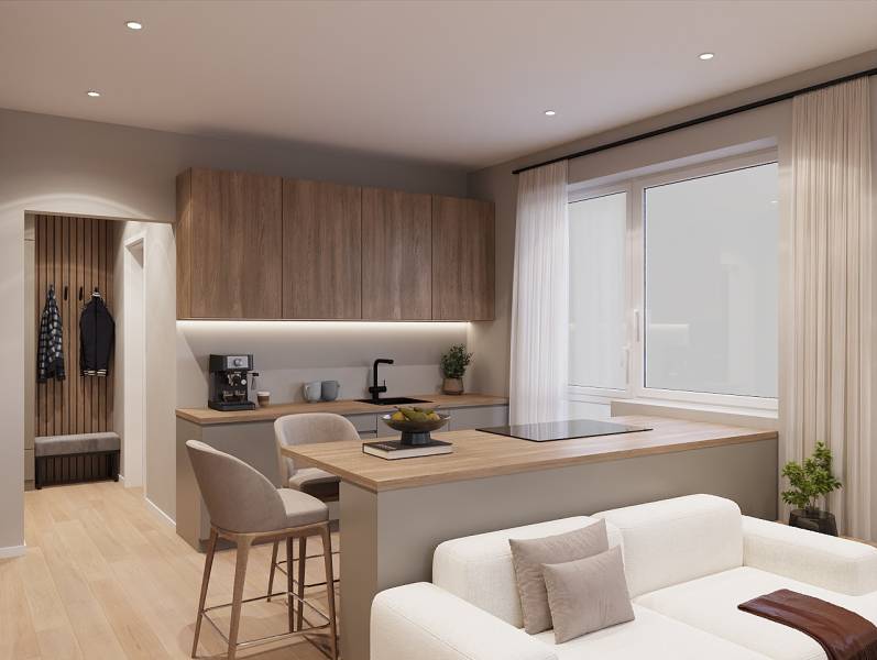 Interior of a 1-room apartment with a wooden decor floor and a kitchenette.
