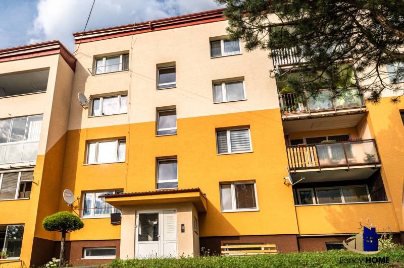 Apartment building on Okružná in Stará Ľubovňa with a multicolored facade and balconies.