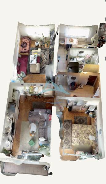 Interior of a 4-room apartment with a wooden decor floor and furniture of various styles.