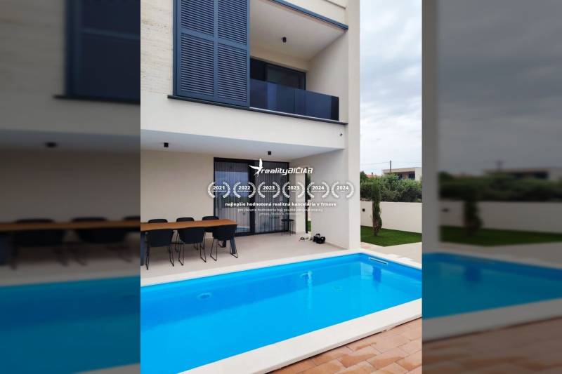 A family house on Mulo Street in Vrsi with a pool and a dining terrace.