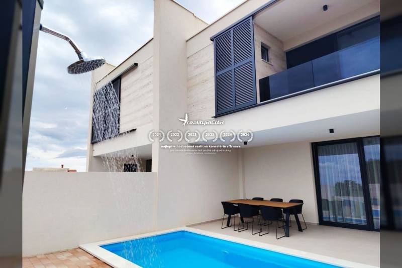 A family house on Mulo Street in Vrsi with a terrace, swimming pool, and outdoor shower.