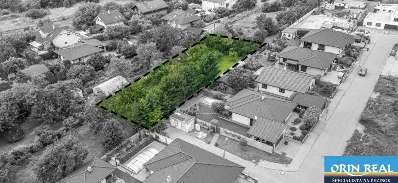 A plot for residential use between family houses on Okružná Street in Bernolákovo.