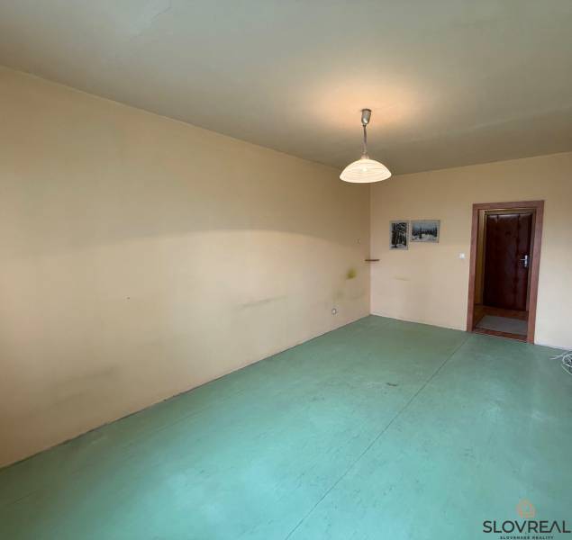 A room in a 3-room apartment with neutral walls and light floor decor.