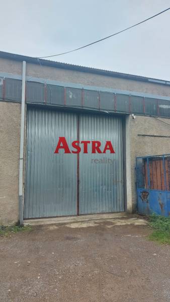 The gate of the warehouse in Košice, Juh district, with a metal surface.