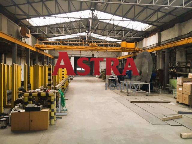 Production premises in Spišská Nová Ves with warehouses and a crane, industrial design.