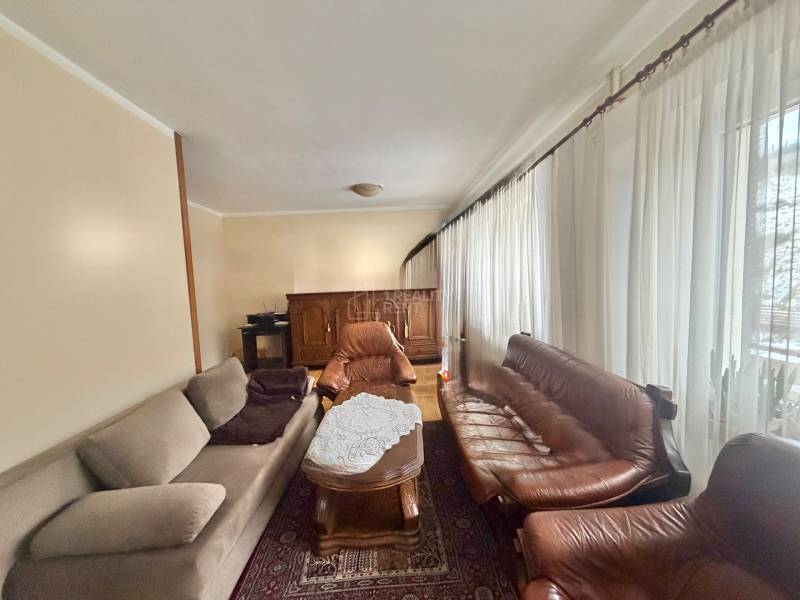 Living room with sofas and a coffee table in a family house.