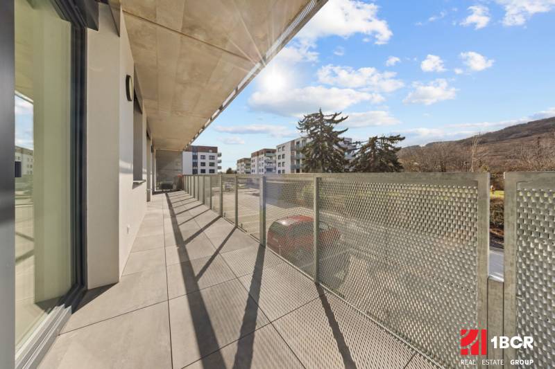 The balcony of a 4-room apartment on Skalická cesta in Bratislava - Nové Mesto with a view of nature.