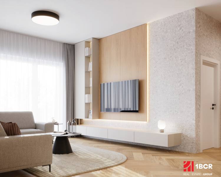 Living room in a 4-room apartment with a wooden decor floor, a light-colored sofa, and a TV on the wall.