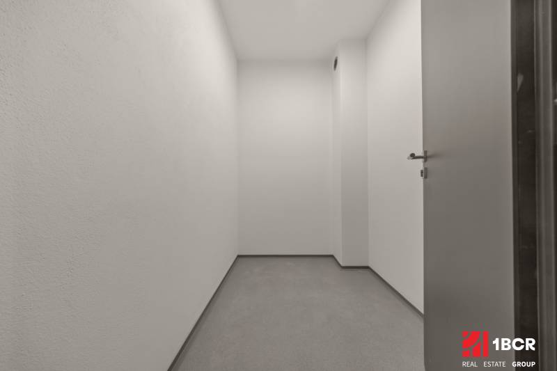 A small room with white walls, enclosed by a door, in a 4-room apartment.