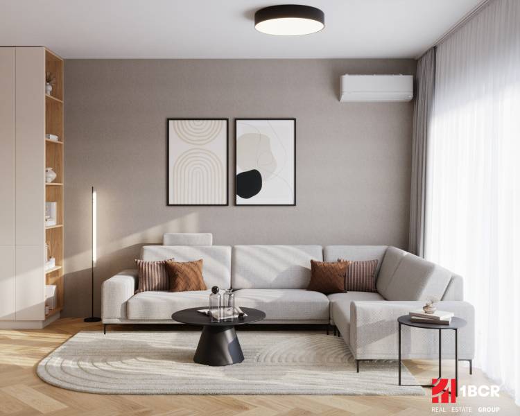 Interior of a 4-room apartment with a sofa, coffee table, and wooden decor flooring.