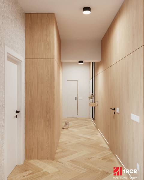 A hallway with cabinets and a wooden decor floor in a 4-room apartment.