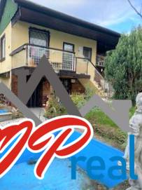 Exterior photograph of a cottage in Košice - Vyšné Opátske district, with verification by a real estate agency.